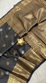 black vintage kanchi pattu saree with gold zari weaving and elephant border