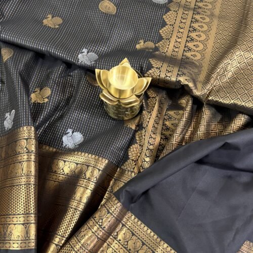 black vintage kanchi pattu saree with gold zari weaving and elephant border