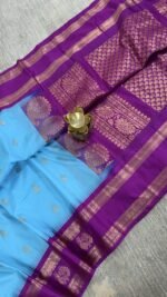 sky blue semi gadwal saree with purple contrast zari border and traditional weaving