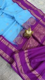 sky blue semi gadwal saree with purple contrast zari border and traditional weaving