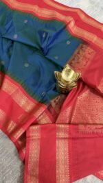 teal blue semi gadwal saree with rust orange zari border and traditional weaving