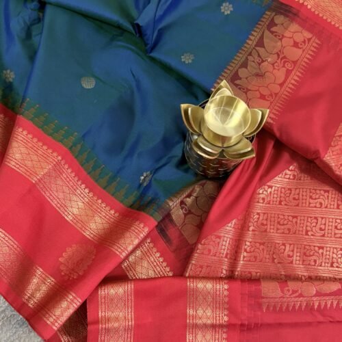 teal blue semi gadwal saree with rust orange zari border and traditional weaving