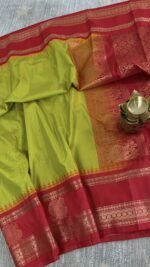 lime green semi gadwal saree with red contrast zari border and traditional weaving