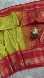 lime green semi gadwal saree with red contrast zari border and traditional weaving