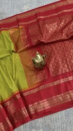 lime green semi gadwal saree with red contrast zari border and traditional weaving