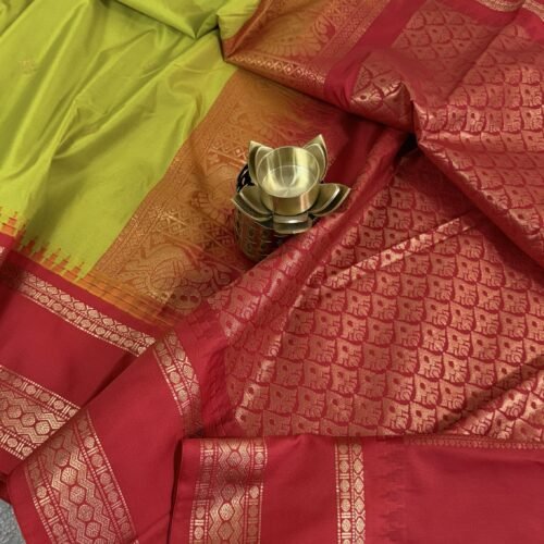 lime green semi gadwal saree with red contrast zari border and traditional weaving