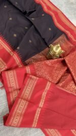 black semi gadwal saree with red contrast zari border and traditional weaving
