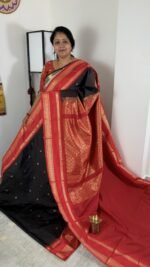 black semi gadwal saree with red contrast zari border and traditional weaving
