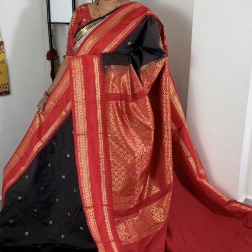 black semi gadwal saree with red contrast zari border and traditional weaving