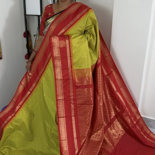 lime green semi gadwal saree with red contrast zari border and traditional weaving