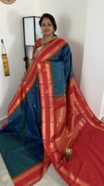 teal blue semi gadwal saree with rust orange zari border and traditional weaving