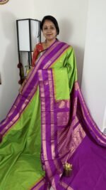 lime green semi gadwal saree with purple zari border and traditional weaving