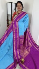 sky blue semi gadwal saree with purple contrast zari border and traditional weaving