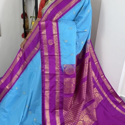 sky blue semi gadwal saree with purple contrast zari border and traditional weaving