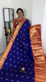 royal blue kanchi gadwal saree with red zari border and meena weaving butties