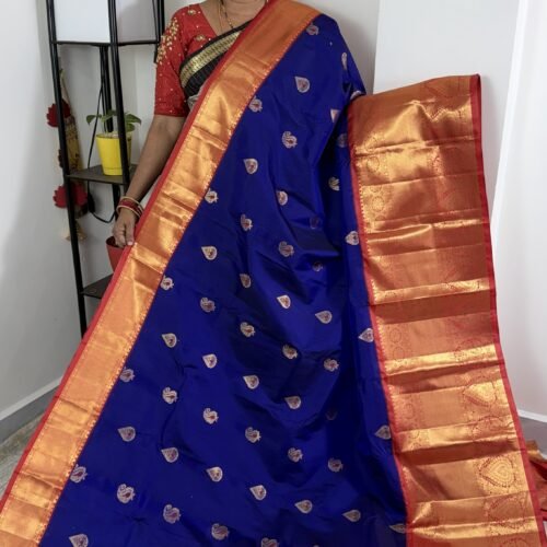 royal blue kanchi gadwal saree with red zari border and meena weaving butties