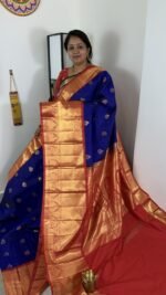 royal blue kanchi gadwal saree with red zari border and meena weaving butties