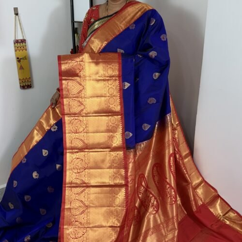 royal blue kanchi gadwal saree with red zari border and meena weaving butties