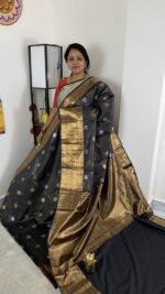 black vintage kanchi pattu saree with gold zari weaving and elephant border