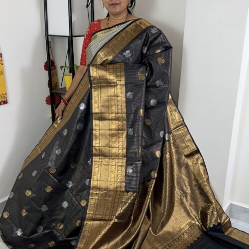 black vintage kanchi pattu saree with gold zari weaving and elephant border