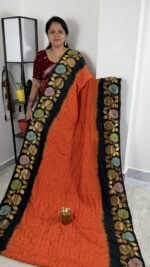 rust orange black jamdani bandhini saree with floral border