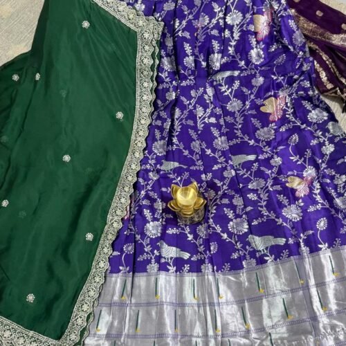purple banarasi semi stitched lehenga with green dupatta and silver zari work