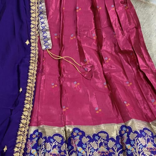 pink and royal blue half saree with kanchi tissue lehenga and elephant peacock border