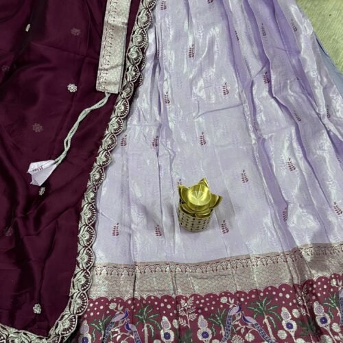lavender and wine pastel half saree with kanchi tissue lehenga and peacock border