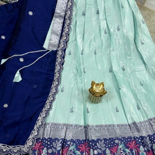 mint green and navy blue pastel half saree with kanchi tissue lehenga and peacock border