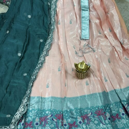 peach and teal pastel half saree with kanchi tissue lehenga and peacock border